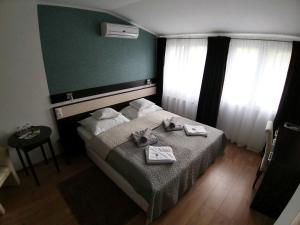 Postel nebo postele na pokoji v ubytování A16 Design Panzió