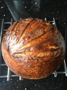 a loaf of bread sitting on a cooling rack at Riverside Guesthouse in Charlestown