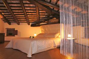 Postel nebo postele na pokoji v ubytování Agriturismo Ronchi Di Sant'Egidio + 34 fotografií