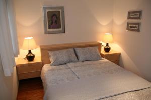 Postel nebo postele na pokoji v ubytování Apartments Cvetje v Jeseni