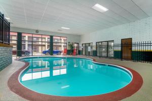 a large swimming pool in a large building at Baymont by Wyndham El Dorado in El Dorado