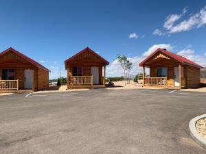 a couple of cottages in a parking lot at Red Canyon Cabins in Kanab