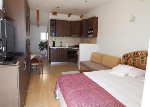 a small room with a bed and a kitchen at Ante in Dubrovnik