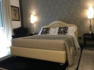 a bedroom with a large bed with pillows on it at Palazzo Bignami in Lecce