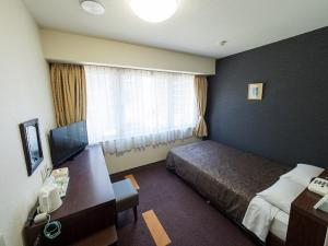 Postel nebo postele na pokoji v ubytování Hotel Shin Osaka / Vacation STAY 81522