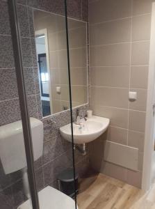 a bathroom with a sink and a mirror at "A Casa dos Avôs" Suites & Breakfast in Lagos +45 photos