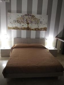 Ein Bett oder Betten in einem Zimmer der Unterkunft APP. TURISTICO ARCO NORMANNO