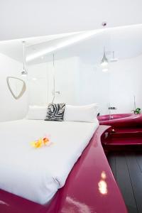 Postel nebo postele na pokoji v ubytování Absoluto Design Hotel