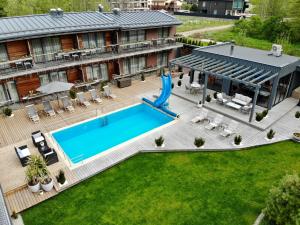 an aerial view of a hotel with a pool and lawn at Vila Vitalija in Palanga