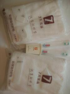 a group of white plastic bags with writing on them at 7Days Premium Meizhou Fengshun Store in Tangkeng +10 photos