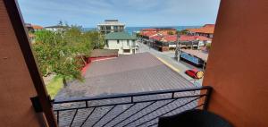 a balcony with a view of a city street at LA CANAPELE ROCK in Vama Veche