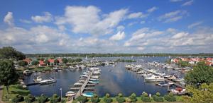 a group of boats are docked in a harbor at Hotel de Abdij in Horn