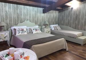 Posteľ alebo postele v izbe v ubytovaní B&B Villa del Sole Relais