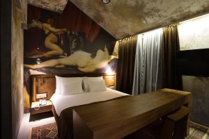En eller flere senger på et rom på Hotel Hemera