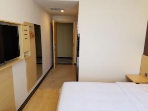 Katil atau katil-katil dalam bilik di 7Days Premium Yantai Penglai New Bus Station Branch