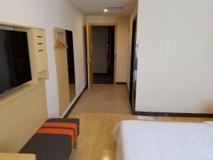 Katil atau katil-katil dalam bilik di 7Days Premium Yantai Penglai New Bus Station Branch