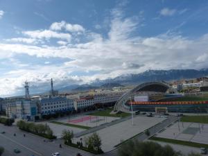 a view of a city with mountains in the background at 7Days Premium Delingha Center Plaza Branch in Delingha