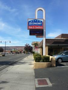a sign for a store on the side of a street at Economy Inn & Suites in St. George