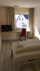 TV a/nebo společenská místnost v ubytování Hotel zur Post