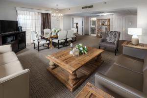 a living room with a couch and a table at Park Place Hotel & Conference Center in Traverse City