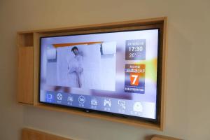 TV a/nebo společenská místnost v ubytování 7Days Premium Baoding Zhuozhou Development Zone Branch