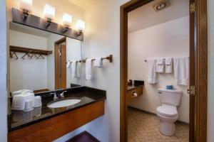a bathroom with a toilet and a sink at Cap Sante Inn in Anacortes