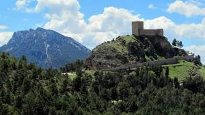 a cross on top of a hill with a mountain at Casa Rural San Francisco I in Siles