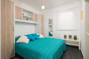 Postel nebo postele na pokoji v ubytování Apartman Petit Val Opatija