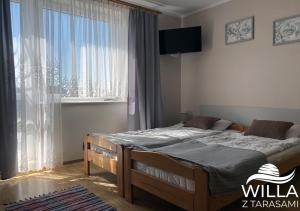 Postel nebo postele na pokoji v ubytování Willa z Tarasami