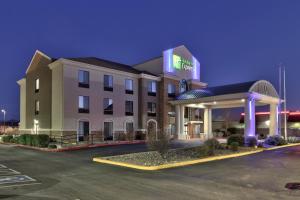 a hotel with a gas station in a parking lot at Holiday Inn Express Socorro, an IHG Hotel in Socorro