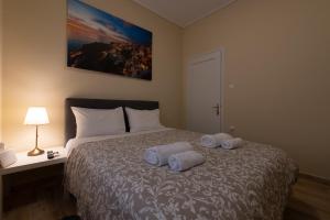 Postel nebo postele na pokoji v ubytování Athens Luxury House