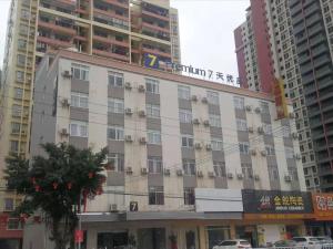 a building in a city with tall buildings at 7Days Premium Yunfu Yunan Branch in Yunan