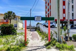 a street sign in the middle of a street at Tropical Isle #112 in Fort Walton Beach