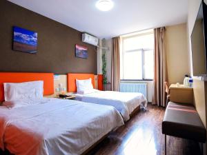 Giường trong phòng chung tại 7Days Inn Beijing Yizhuang Development Zone +26 ảnh