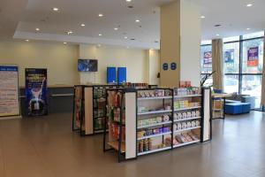 a store aisle with shelves of products in a store at 7 Days Hotel Ziyang Songtao Road Branch in Ziyang