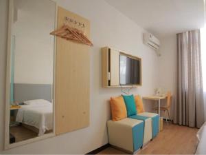 TV a/nebo společenská místnost v ubytování 7Days Inn Qinzhou Niannianfeng Plaza Xiangyang Street Branch