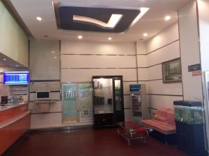 a gas station with a bench and a gas pump at 7Days Inn Zhuzhou Train Station Gongxiao Buildind Branch in Zhuzhou