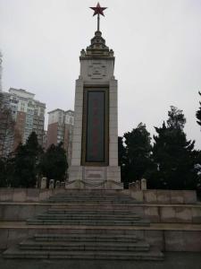 a monument with a cross on top of a tower at 7Days Inn Lu'an Wanda Plaza Branch in Lu'an
