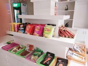a refrigerator filled with lots of different types of food at 7 Days Inn Nanchang Qingshanhu Avenue Minfeng Road Branch in Nanchang