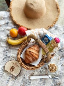 a basket of food and a hat on a table at Gabba Central Apartments in Brisbane