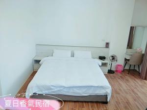 Penghu Summer Aroma Homestay 객실 침대