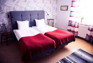 Postel nebo postele na pokoji v ubytování Lilla Hotellet