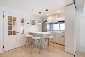 A cozinha ou cozinha compacta de NC Square Shinjuku -All Suite Residence-