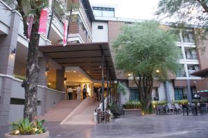 a lobby of a building with people walking into it at Romyen Garden Place in Nakhon Ratchasima