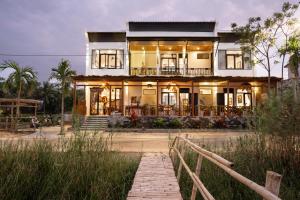 Photo de la galerie de l'établissement The Boathouse Riverside Homestay, à Hội An