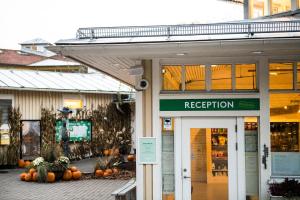 a store with pumpkins in front of a building at Lisebergsbyns Vandrarhem in Gothenburg