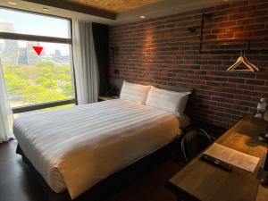 Postel nebo postele na pokoji v ubytování City Suites - Kaohsiung Pier2