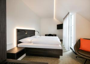Postel nebo postele na pokoji v ubytování Hotel Spitzerberg by b-smart