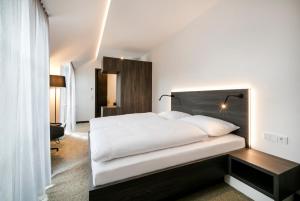 Postel nebo postele na pokoji v ubytování Hotel Spitzerberg by b-smart