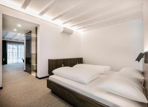 Postel nebo postele na pokoji v ubytování Hotel Spitzerberg by b-smart